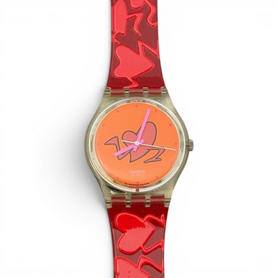 an image of a red watch with hearts on it