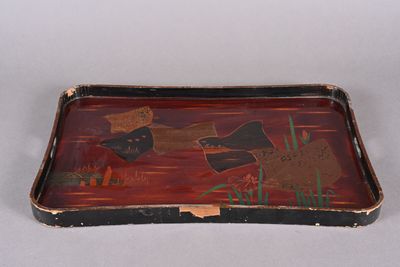 a tray that has a fish design on it