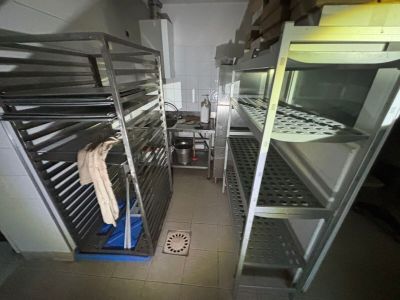 an image of a commercial kitchen with stainless steel racks