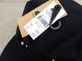 a black hat with a price tag attached to it