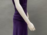 an image of a mannequin wearing a purple dress with ruffles on the shoulders