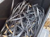 a black container with a bunch of black strips in it