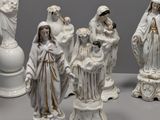 several figurines of jesus, mary, and other religious figures