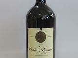 a bottle of wine that is sitting on a table