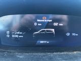 the dashboard of a car with a digital display showing the speed of a car