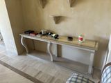 a table with a phone on it in the corner of a room