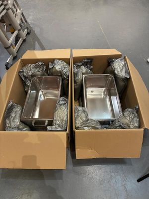 two boxes of food that are sitting on the floor