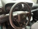 dashboard of a car with a steering wheel and dashboard controls