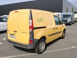 a yellow van that is parked in a parking lot