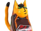 brightly colored cat figurine sitting on white surface with white background