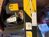 a box with a camera and a pair of shoes in it