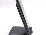 a cell phone that is sitting on top of a stand