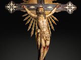 an image of a statue of jesus on a cross on a black background