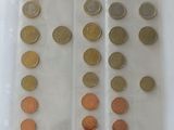 a lot of coins in a plastic bag on the table