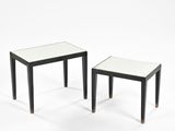 pair of black and white side tables with glass tops