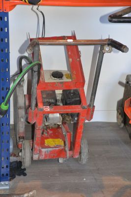 an image of a garage with tools on the floor
