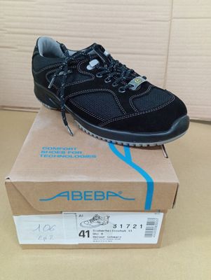 the shoe is sitting on top of a box on the floor