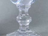 a glass of water sitting on top of a table