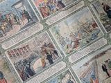 many pictures of people on the wall of a building