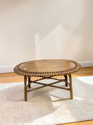 a coffee table that is on a rug in a room