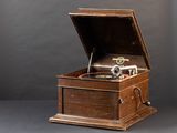 a wooden box with a record player inside of it