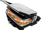 a close up of a sandwich maker with a sandwich in it