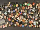 many different types of badges on a black surface