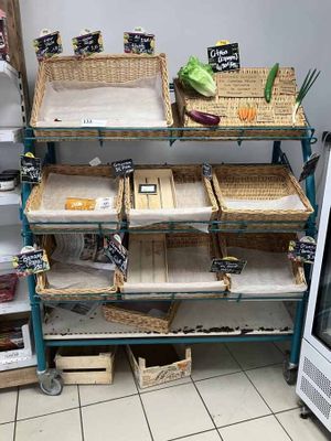 many baskets of food on the shelves in the store