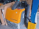 a forklift that is sitting in a garage