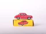 a red toy car sitting on top of a yellow box