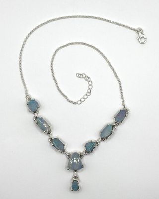 silver necklace with blue glass beads and a silver chain