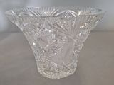 a glass vase that is sitting on a table