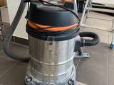a vacuum that is sitting on the floor in the room
