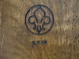 an image of a close up of a metal object with a logo on it