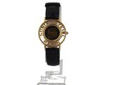an image of a black and gold watch with roman numerals on the face