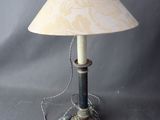 a lamp that is sitting on a table with a lamp on it