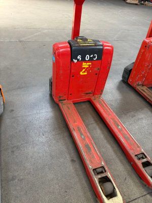 two red forklifts sitting in a warehouse