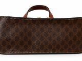 a close up of a brown and black bag on a white background