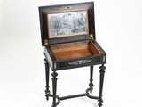 an old black and white photo of a wooden box on a stand
