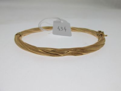 a gold plated bracelet with twisted wire and a price tag
