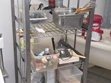 a kitchen with a lot of items on the shelves