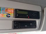 a car dashboard with a lot of stickers on it