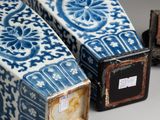 three blue and white vases sitting next to each other on a table