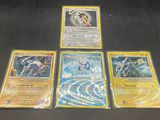 a lot of pokemon cards on a black table