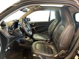 the interior of a car with the door open and the steering wheel down