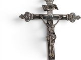 silver cross with crucifix on a white background