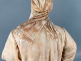 an image of a statue of a woman with a scarf on her head