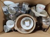 a box full of tea cups and saucers in it