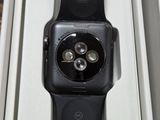 an apple watch sitting on top of a box on a table