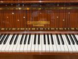 a piano that is sitting in a room